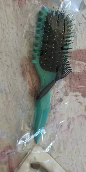 A smiling child with smoothly brushed hair.